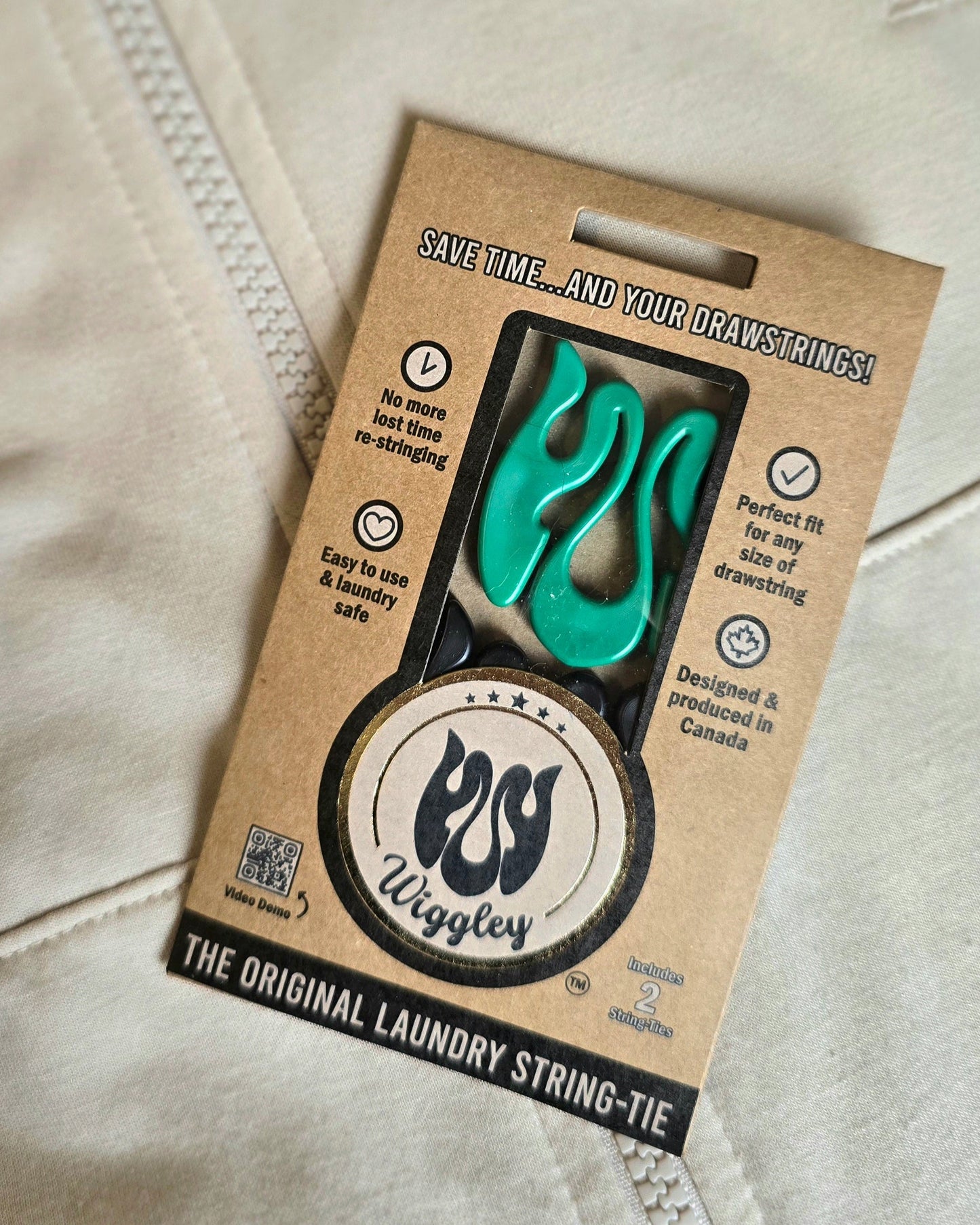 Wiggley laundry string tie packaging on a beige background
