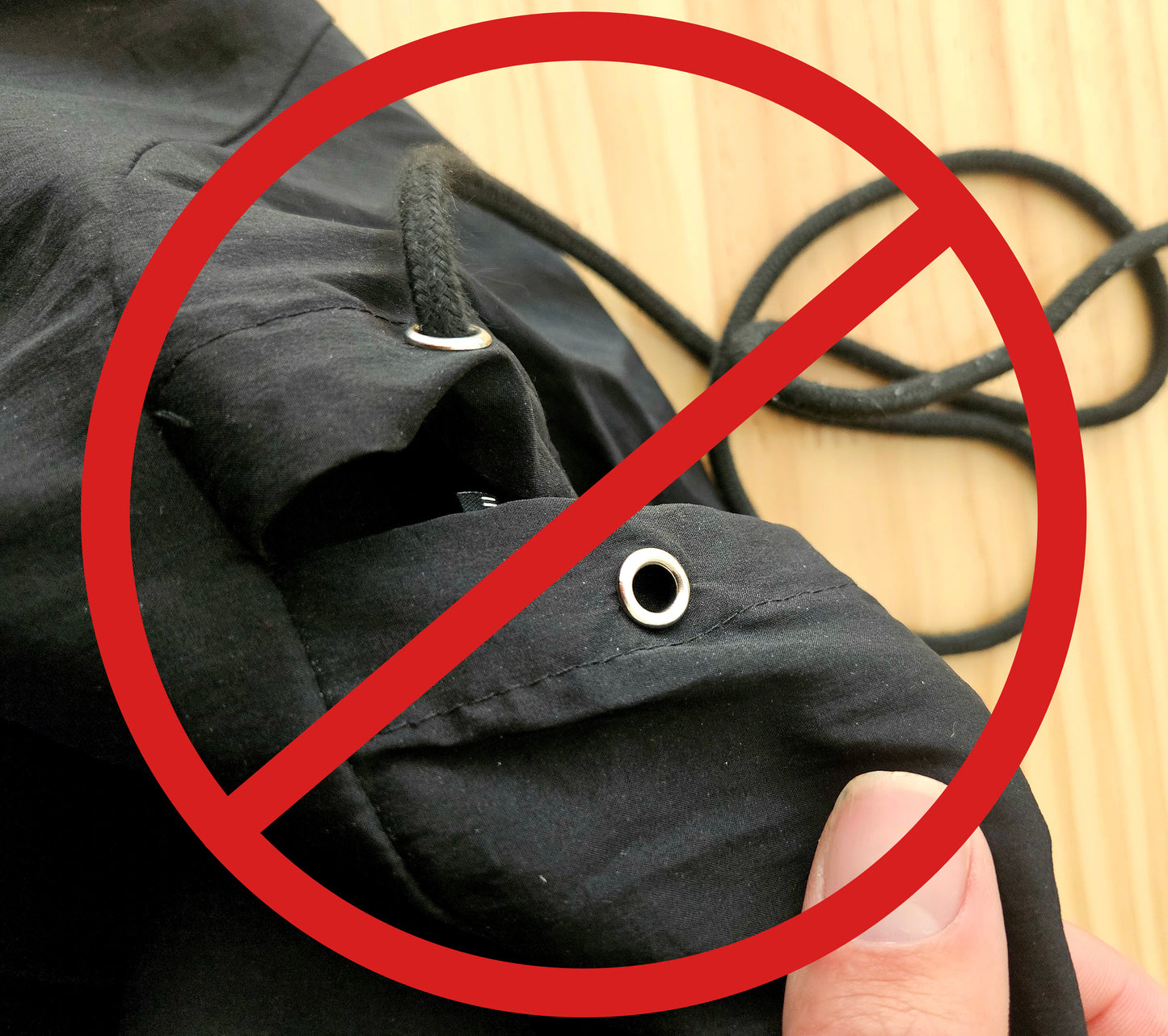 The solution for drawstrings that fall out in the laundry, The Wiggley String-tie. Photo shows the struggle of drawstrings pulling out in the wash. 